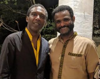 Lemn Sissay: author, broadcaster, poet and Chancellor of the University of Manchester, pictured here together with CHRE lectur-er, poet, author and activist Yirga Woldeyes.
