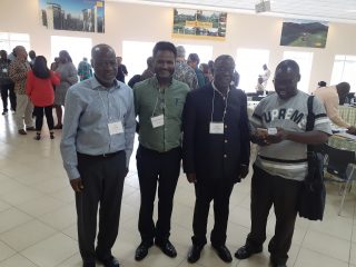Yirga (2nd from L) is with with Professor Jacob Olupona from Harvard University and Professor Tite Tienou from Trinity International University